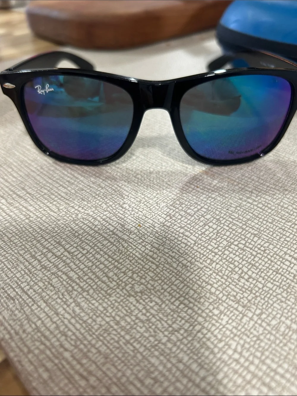 Ray-Ban Black Frame Sunglasses with Blue-Purple Mirrored Lenses